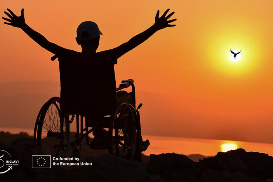 Man sitting in a wheelchair and lifting his hands like antennas while embracing the beautiful sunset in the horizon.